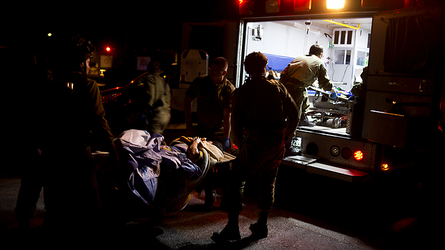 IDF troops evacuate wounded Syrians to hospitals in Israel for treatment (Photo: AP)