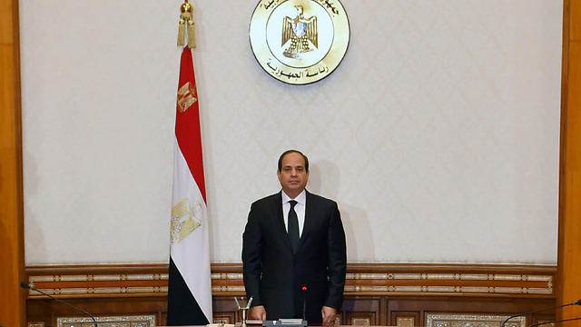 Egyptian President el-Sisi stands and observes a minute of silence for the victims of the attack (Photo: Reuters)