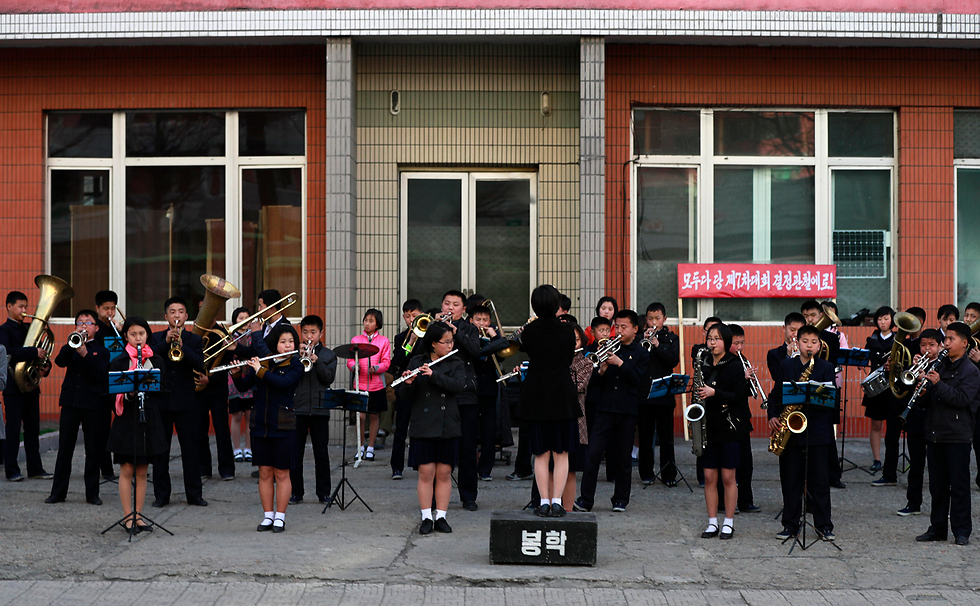 Школьный оркестр в Пхеньяне готовится к важному событию. Фото:EPA