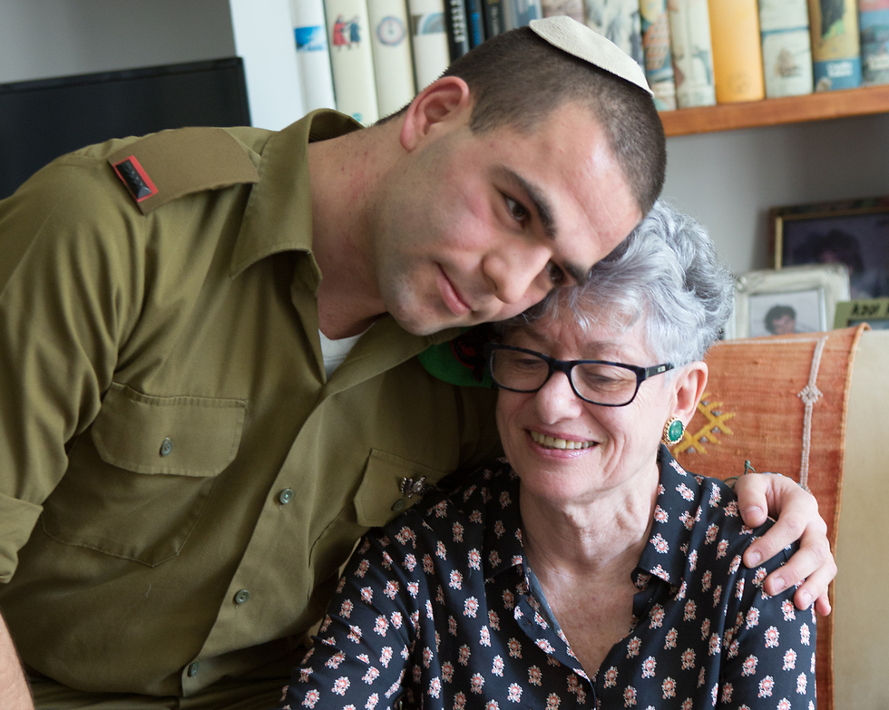 2nd Lt. Noam Korev with his grandmother, Hava (Photo: Alex Kolomoisky)