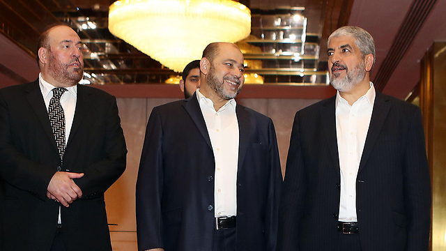 L to R: Nazzal, Abu Marzuq and Mashal in Qatar (Photo: AFP)