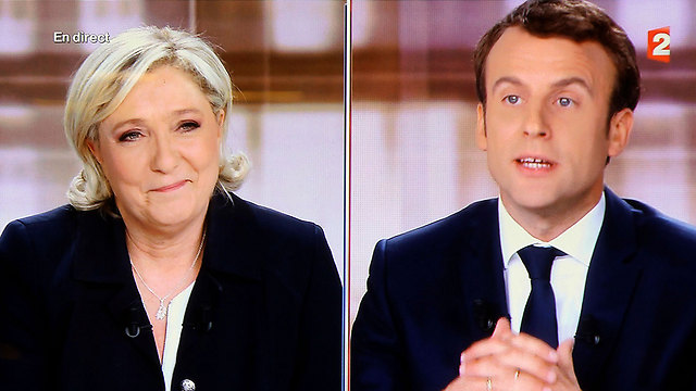 Le Pen (L) and Macron (Photo: AP)