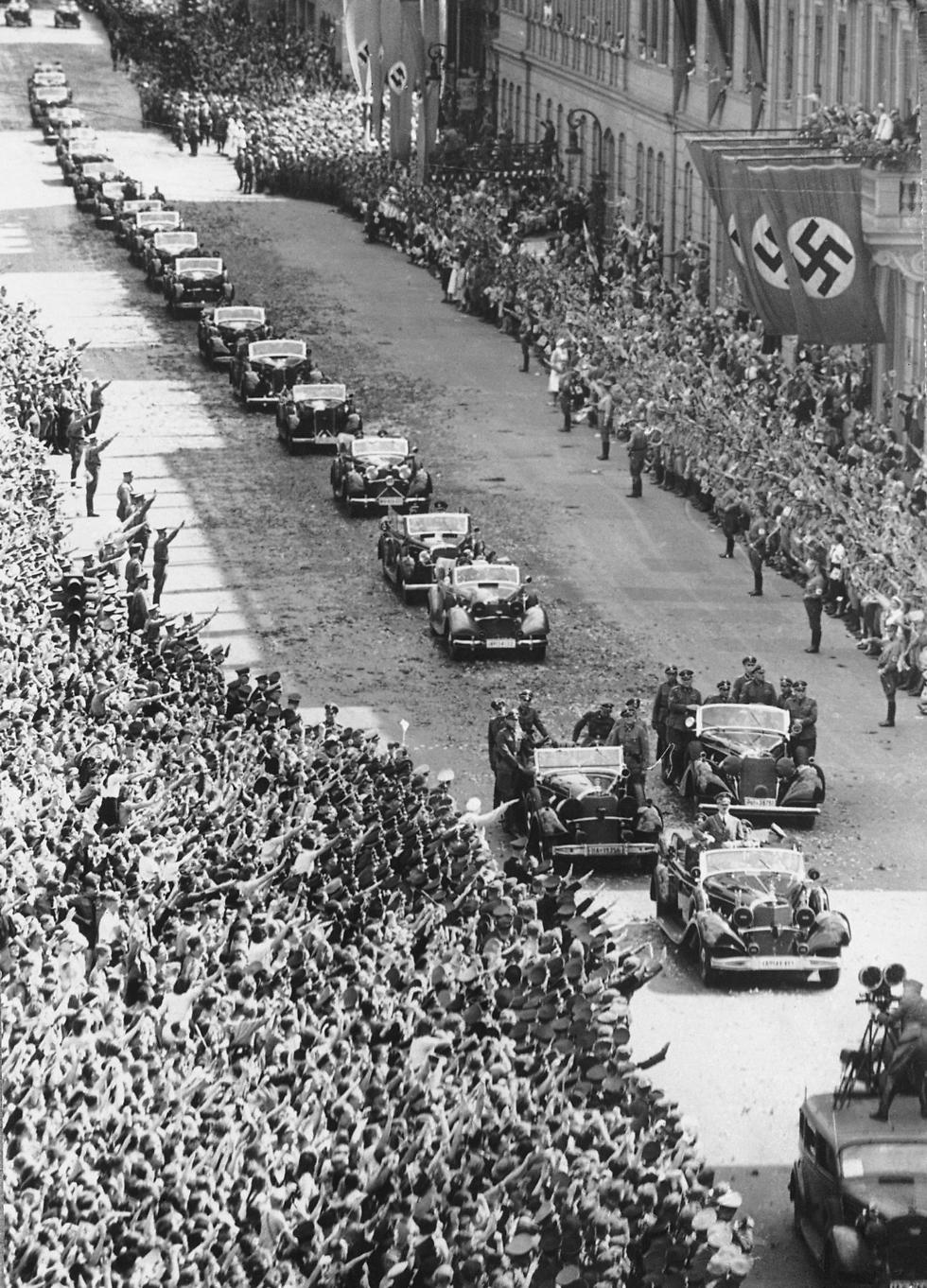 German Chancellor Adolf Hitler stands in the front car of a motorcade upon his arrival at the chancellery in Berlin on July 6, 1940, after returning from Compiegne, where France surrendered to Germany (Photo: AP) (Photo: AP)