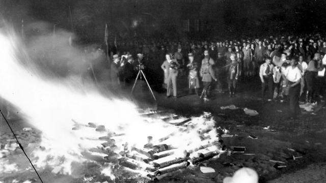 A crowd gathers to witness thousands of books, considered to be "un-German," burn in Opera Square in Berlin, Germany, during the Buecherverbrennung book burnings on May 10, 1933 (Photo: AP) (Photo: AP)