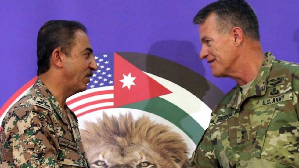 US Maj. Gen. Ralph H. Groover (R) and Jordanian Brig. Gen. Fahed Al-Damen shake hands following a press conference about the 2016 'Eager Lion' joint military exercise in Amman, on May 15, 2016. (Photo: AFP)