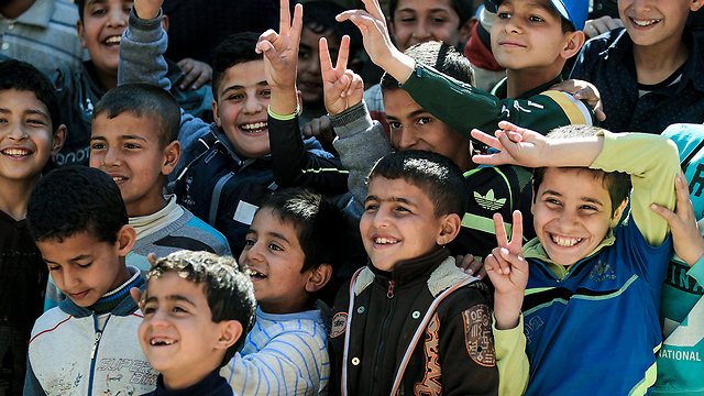לקראת שחרור: הילדים במוסול חוגגים (צילום: AFP) (צילום: AFP)