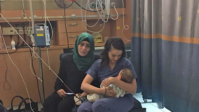 Palestinian mother and her sick child in Israeli hospital