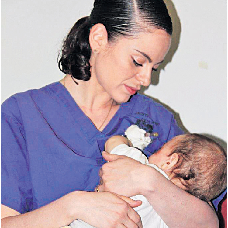 Nurse Ula Ostrowski-Zak nursing baby Yaman. ‘He just happened to be Palestinian’ (Photo: Hadassah Ein Kerem Medical Center) 