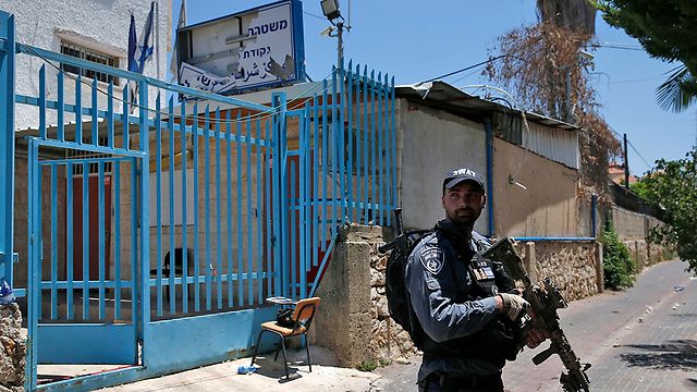 Yasam forces posted outside the Kafr Qassim police station the day after the rioting (Photo: AFP)
