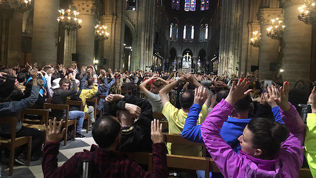 Worshippers inside the cathedral were told to stay inside and raise their arms.