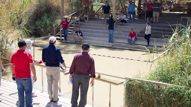 The Jordan River, the international border between Israel and Jordan, but today narrow enough to hold a conversation across (Photo: Robert Swift/The Media Line
