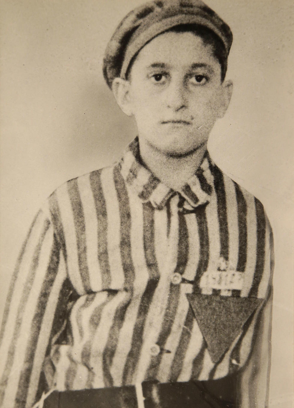 In this undated World War II-era photograph provided by Many Hats Productions, Holocaust survivor Steve Ross wears a Nazi prison camp uniform. (Photo: AP) (Photo: AP)