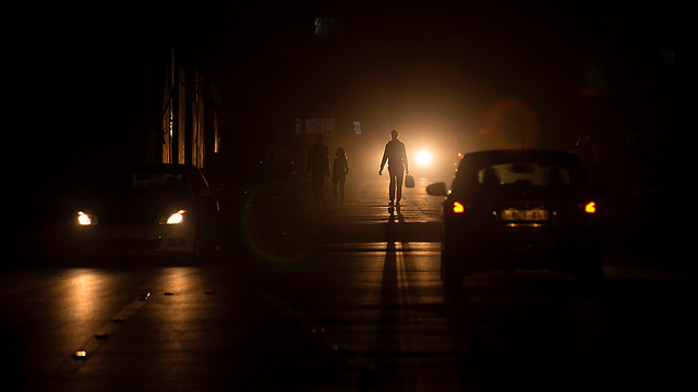 A Gaza street during a power outage. ‘This Ramadan, there is no available money. Nearly one million unemployed people can’t find a way to make a living’ (Photo: AFP)
