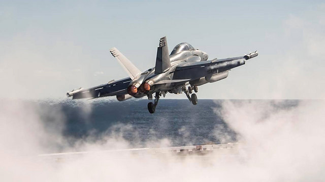 Aircraft taking off from the deck of USS George H.W. Bush