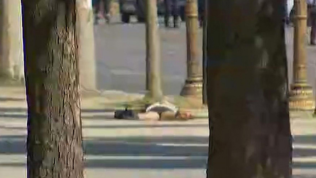 Man laying on ground following attack, unclear whether he is the attacker (Photo: AP)