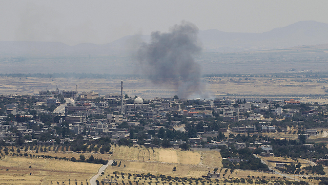 עשן בצד הסורי של רמת הגולן (צילום: AFP) (צילום: AFP)
