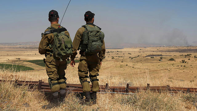 IDF troops on the Golan border as fighting rages in Quneitra  (Photo: AFP)