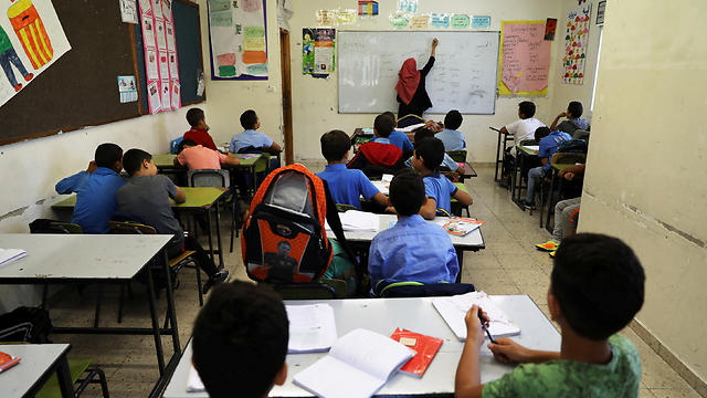 Palestinian children attend a class in a school in the east Jerusalem neighborhood of Jabel Mukhaber. (Photo: Reuters)