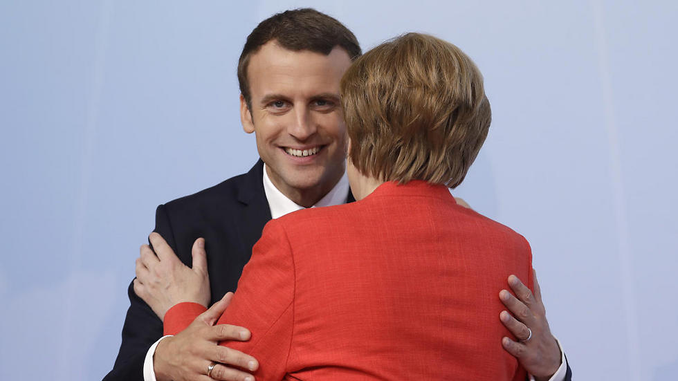 Merkel welcomes French President Macron to the summit (Photo: AP)