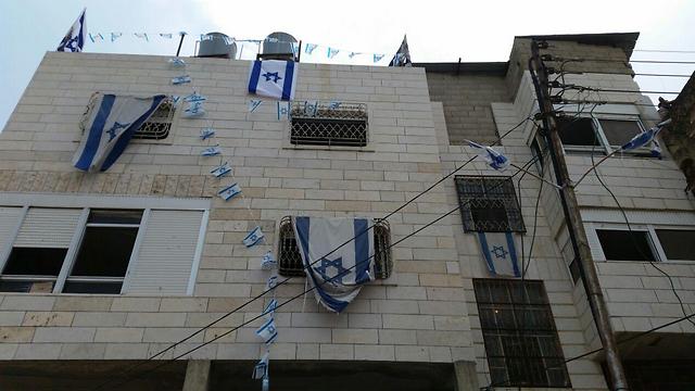 Jewish families take ownership of contested building in Hebron (Photo: Eli Mandelbaum)