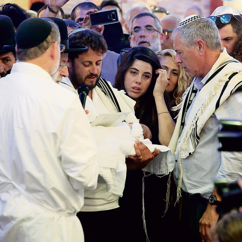 Chen and Shmuel Salomon at their firstborn's circumcision ceremony in Elad, last week. 'It only strengthened the joy over the child' (Photo: Shaul Golan)
