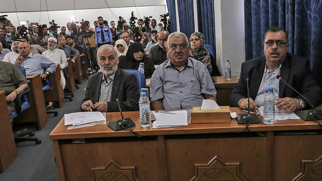 Palestinian MP Majed Abu Shamala (R) at the meeting (Photo: AFP)
