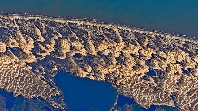 "כמו ארמונות חול על חוף הים" (צילום: ג'ק פישר, נאס"א) (צילום: ג'ק פישר, נאס