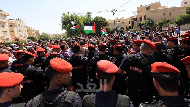 Jordanian security forces trying to disperse the protestors