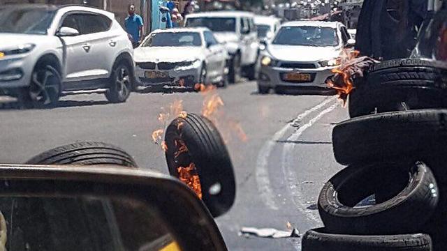 Burning tires in protest in Jaffa