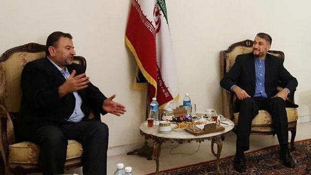 Deputy Hamas leader Saleh al-Arouri, left, meeting with an Iranian official in Beirut