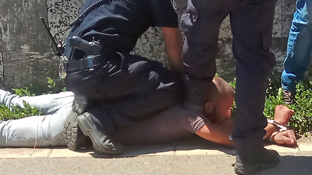 The terrorist arrested at the scene of the attack (Photo: Matan Zuckert)