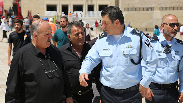 Parents of slain officers with police commanders (Photo: Israel Police)