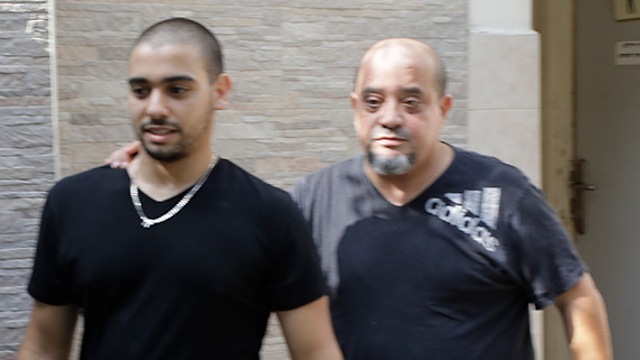 Azaria leaving court with his father (Photo: Shaul Golan)