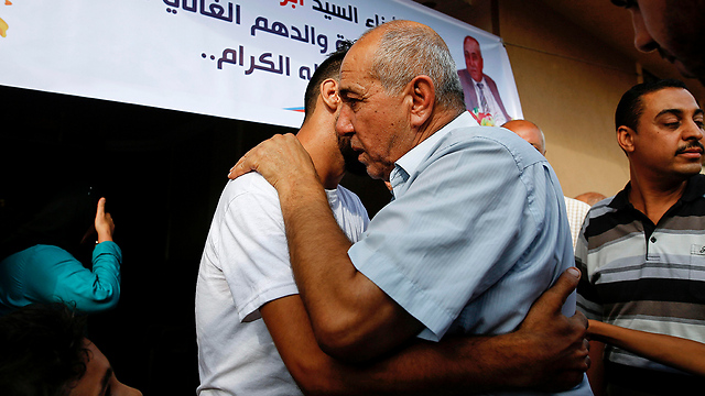 Timraz upon being returned to the Gaza Strip (Photo: AFP)