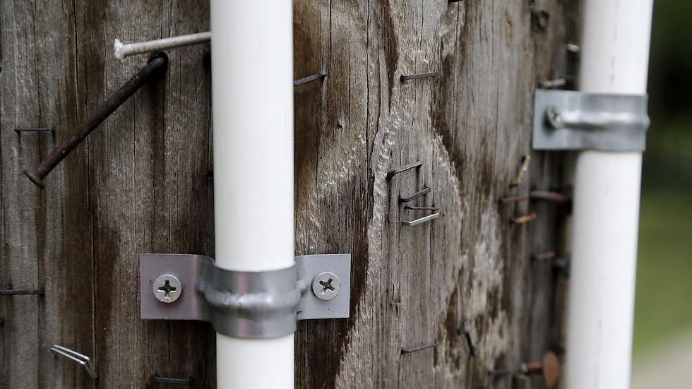 PVC piping placed on utility poles around a New Jersey town bordering New York as eruv for Jewish community (Photo: AP)
