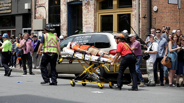 A wounded protestor is evacuated for treatment (Photo: Reuters)