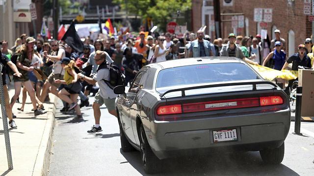 Car plowing into crowd of counter-protesters in Charlottesville (Photo: EPA)
