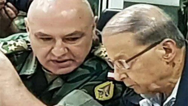 Commander of the Lebanese Armed Forces Joseph Aoun (L) speaking with Lebanese President Michel Aoun