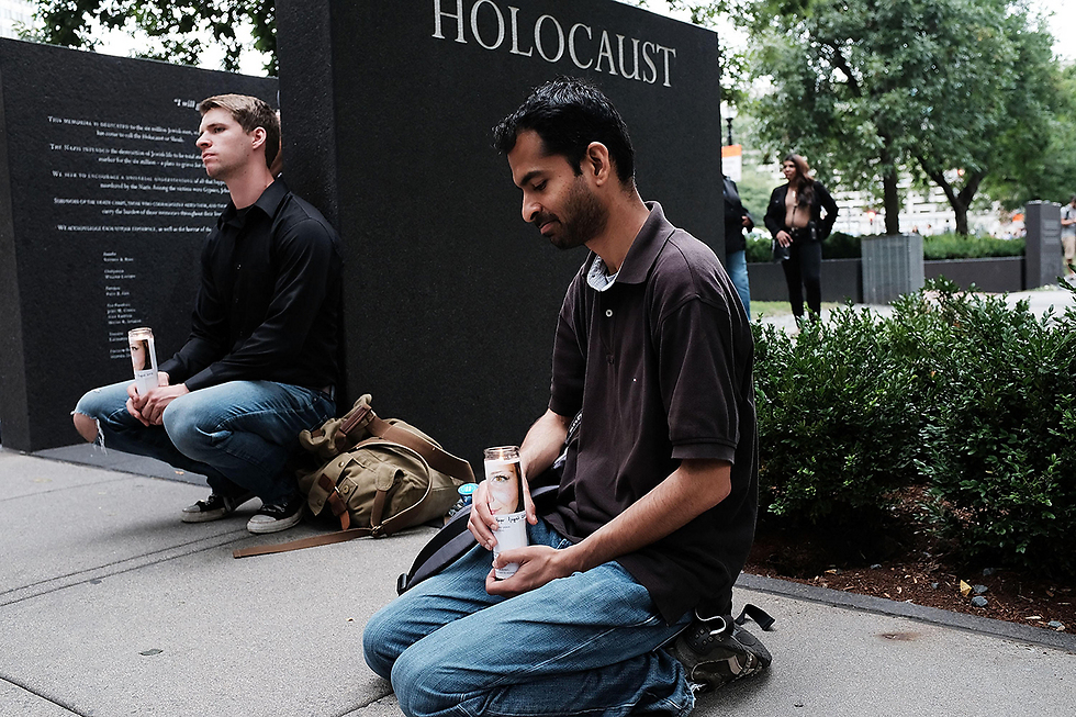 Counterprotestors near a Holocaust memorial (Photo: AFP)