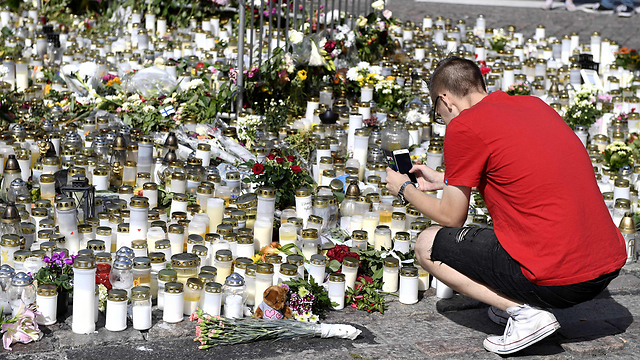 Vigil at the scene of the Aug. 18 attack in Turku, Finland (Photo: AFP)