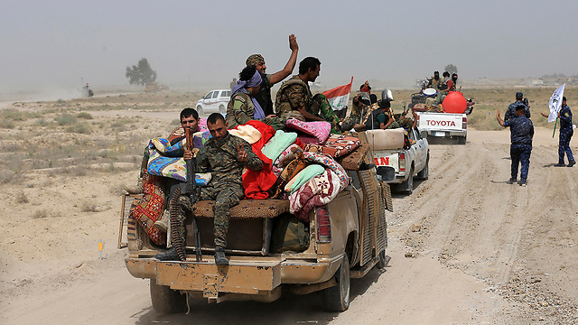 שיעים שנלחמו בדאעש בעיראק. ארה"ב נמנעה מחיסול סולימאני כי סייע לה (צילום: AP) (צילום: AP)