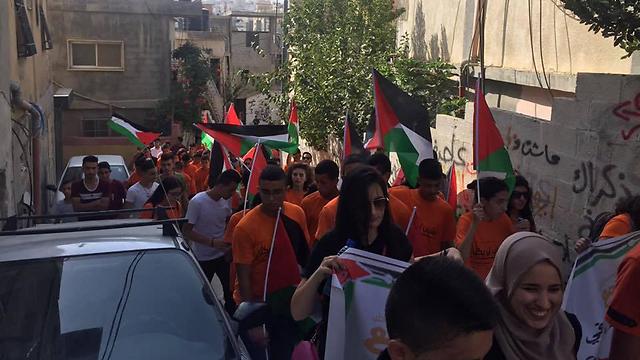 Palestinian flags in Balad summer camp march