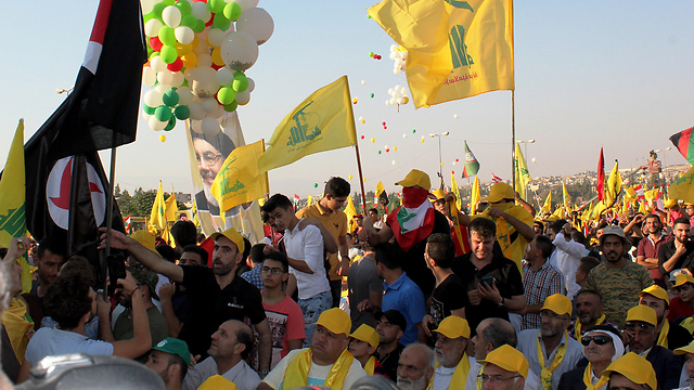 Hezbollah supporters celebrating the removal of ISIS from the Lebanese border (Photo: EPA)