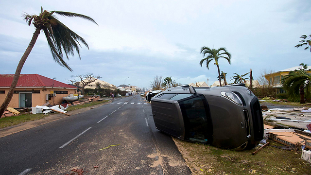 Overturned car in St. Maarten (Photo: AFP)