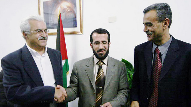 Khaled Abu-Arfa, center, with MK Jamal Zahalka, right and former MK Wasil Taha, left (Photo: Gil Yohanan)