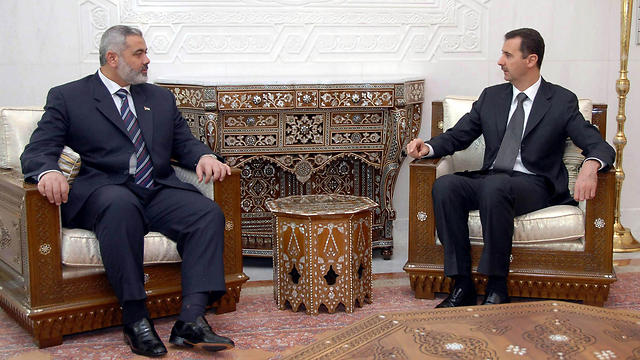 Dec. 4, 2006: Syria's President Bashar Assad (R) meets with Palestinian Prime Minister Ismail Haniyeh in Damascus, Syria (Photo: AP)