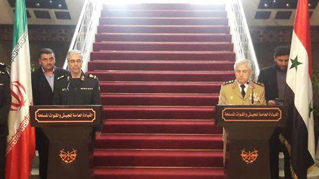 Iran's military chief Baqeri, left, and his Syrian counterpart Ayyoub