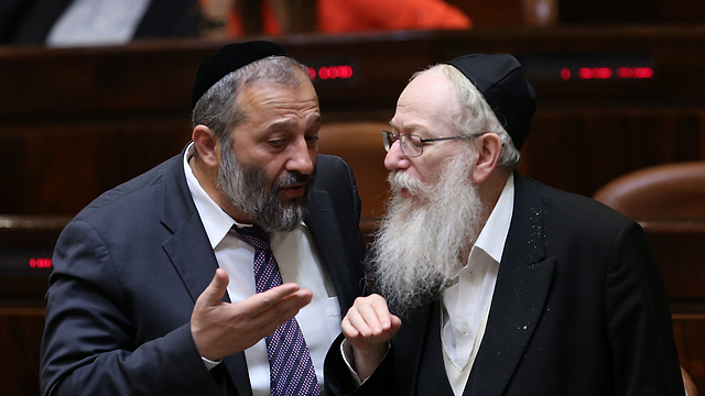 Interior Minister Aryeh Deri (L) and Deputy Minister Yaakov Litzman (Photo: Alex Kolomoisky)