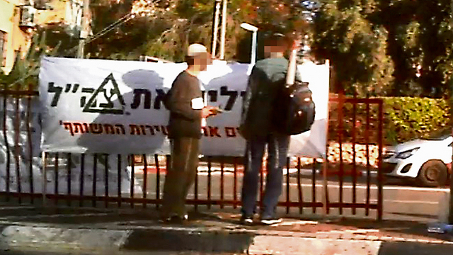 Brothers in Arms activists handing out pamphlets