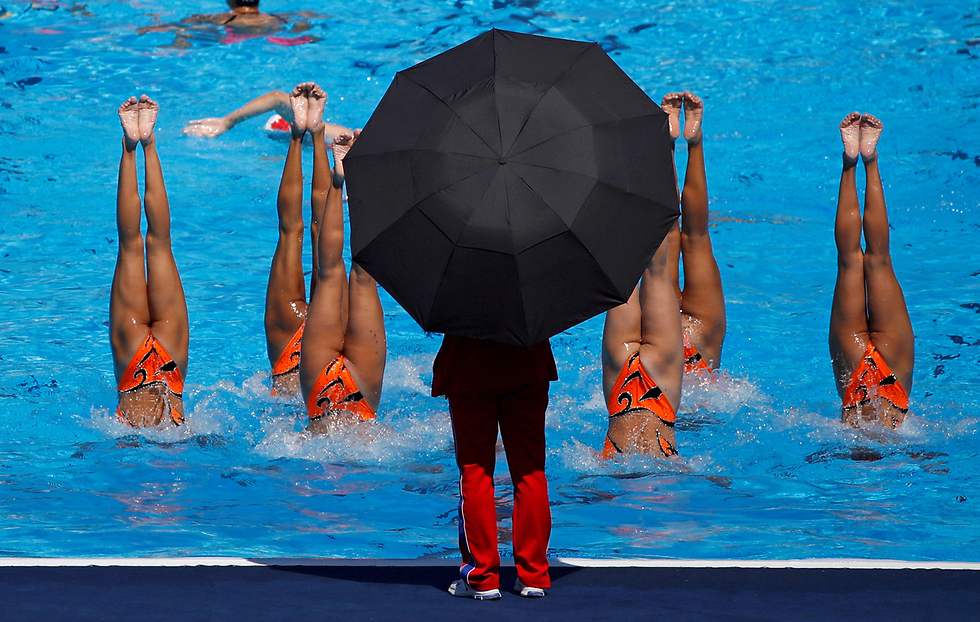 אימון של נבחרת צפון קוריאה בשחייה צורנית (צילום: רויטרס) (צילום: רויטרס)